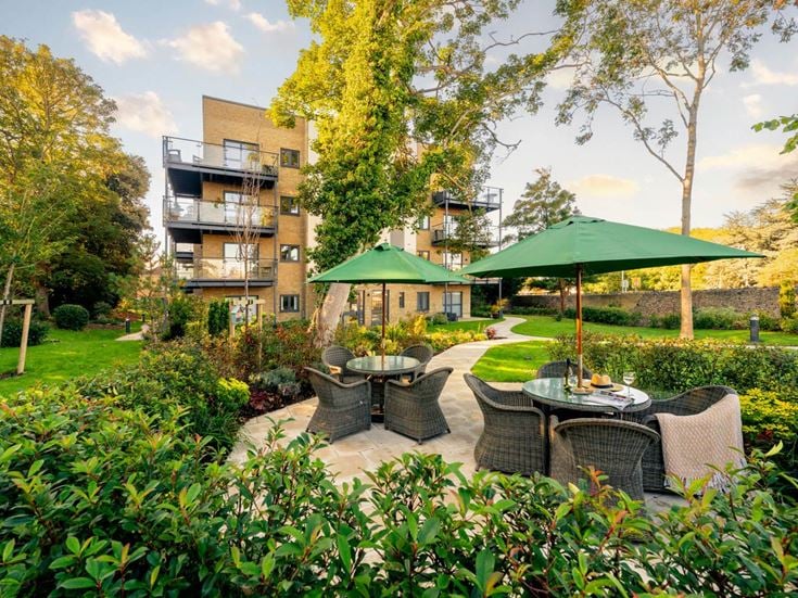 a backyard with a table and chairs