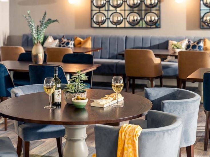 a room with chairs and tables