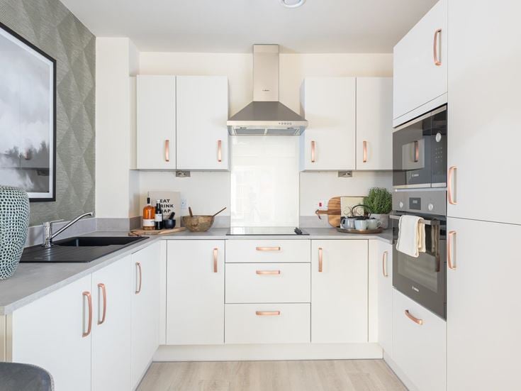 a kitchen with white cabinets