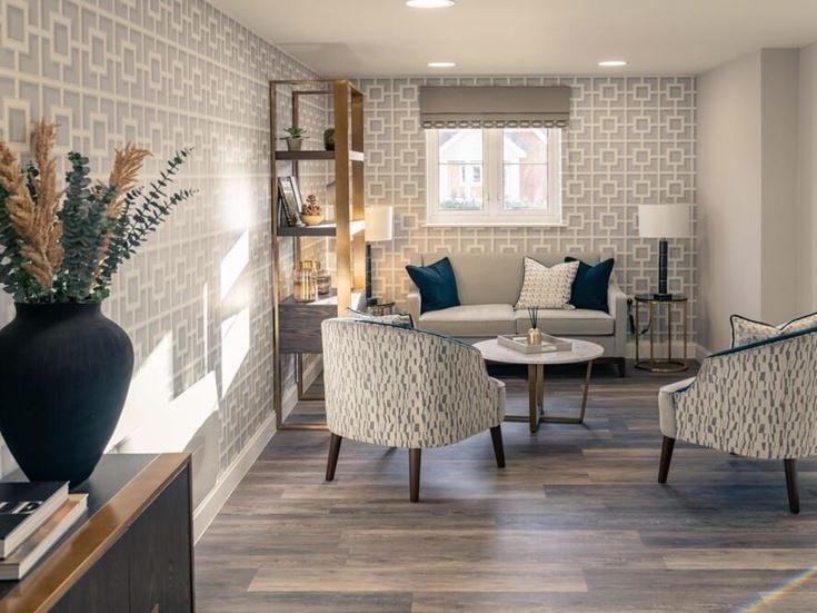 a living room with a white brick wall and a white couch