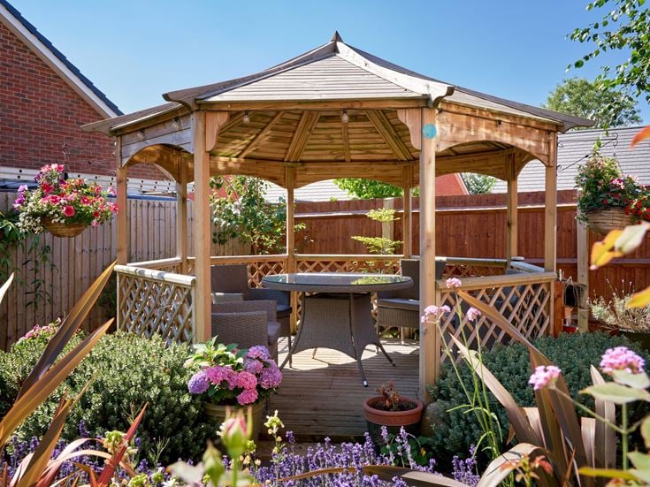 a patio with a table and chairs