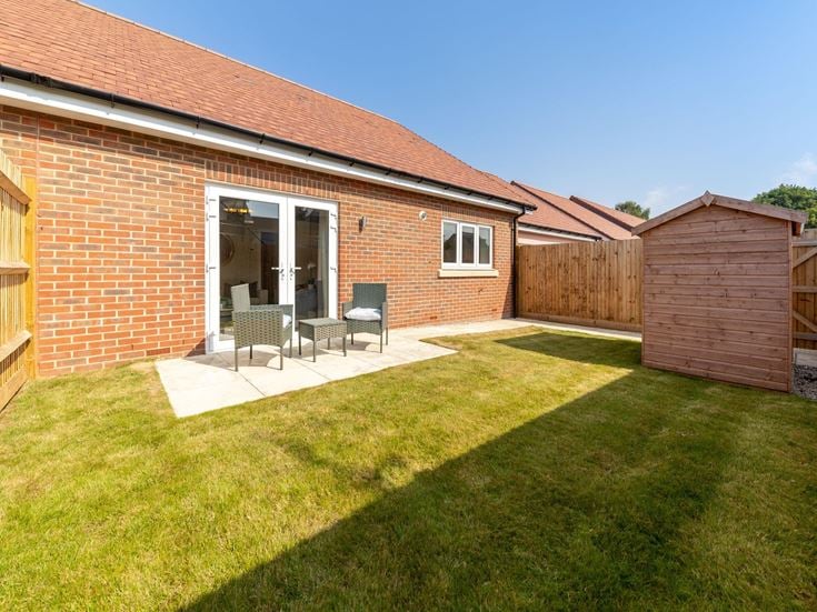 a brick house with a lawn