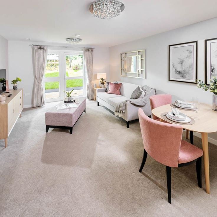 a living room with a table and chairs
