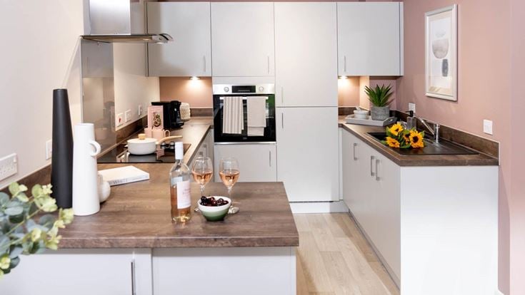 a kitchen with a marble counter top