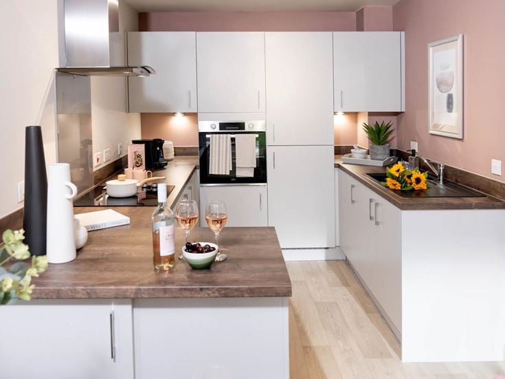 a kitchen with a marble counter top