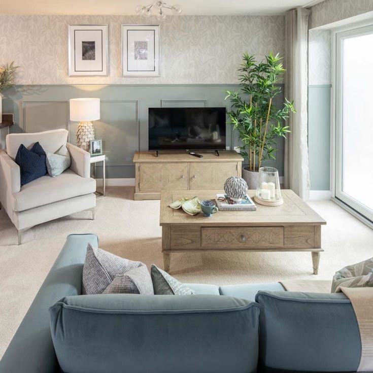 a living room with a tv and couches