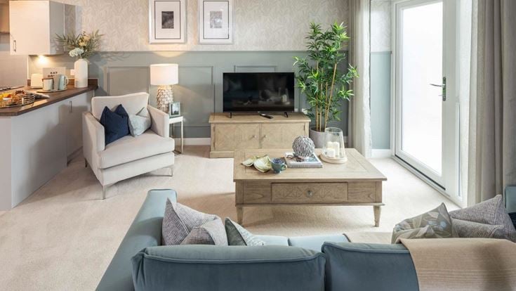a living room with a tv and couches