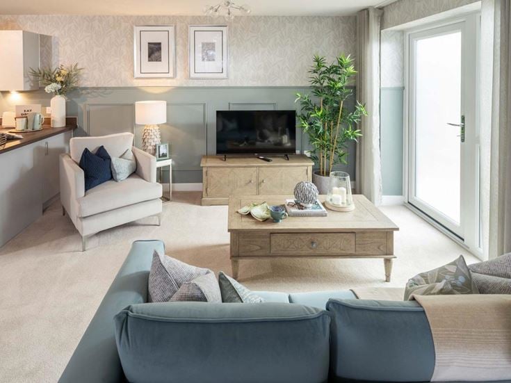 a living room with a tv and couches