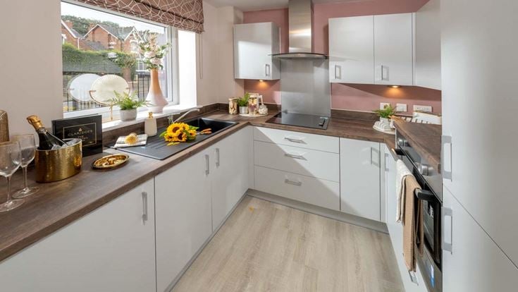 a kitchen with white cabinets