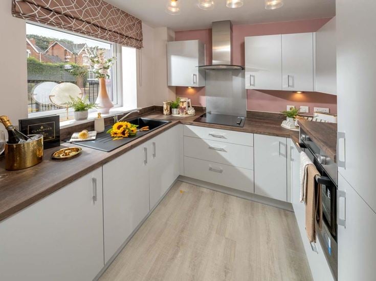 a kitchen with white cabinets