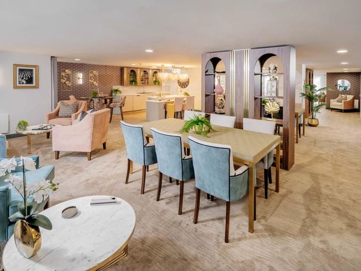 a large room with a dining table and chairs