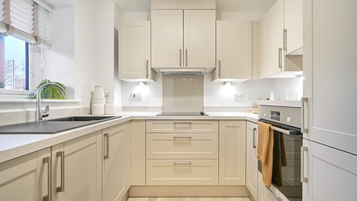 a kitchen with white cabinets