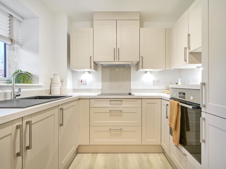a kitchen with white cabinets