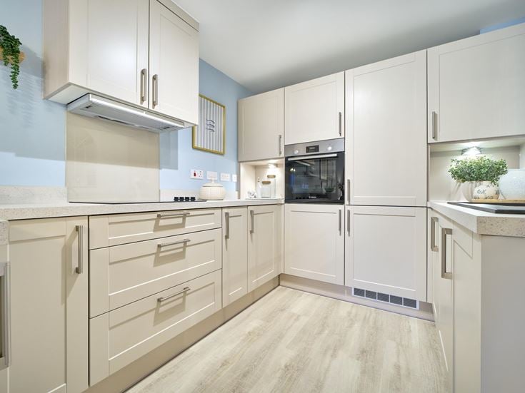 a kitchen with white cabinets