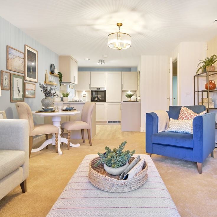 a living room with a dining table and chairs