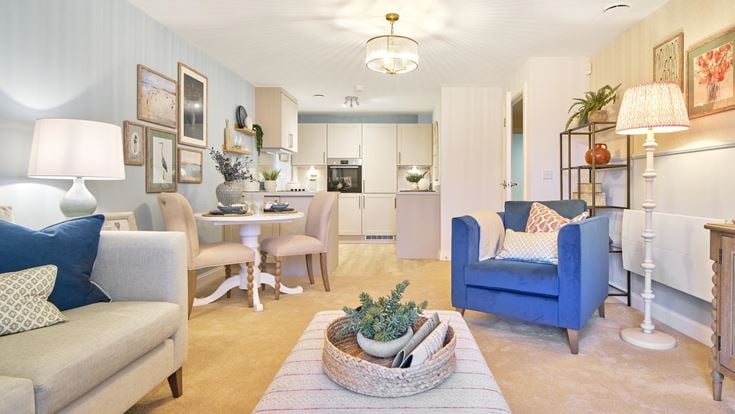 a living room with a dining table and chairs