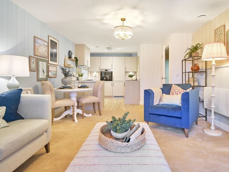a living room with a dining table and chairs
