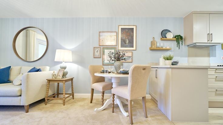 a living room with a white couch and a table