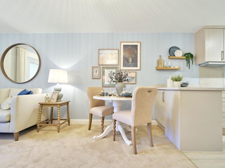 a living room with a white couch and a table