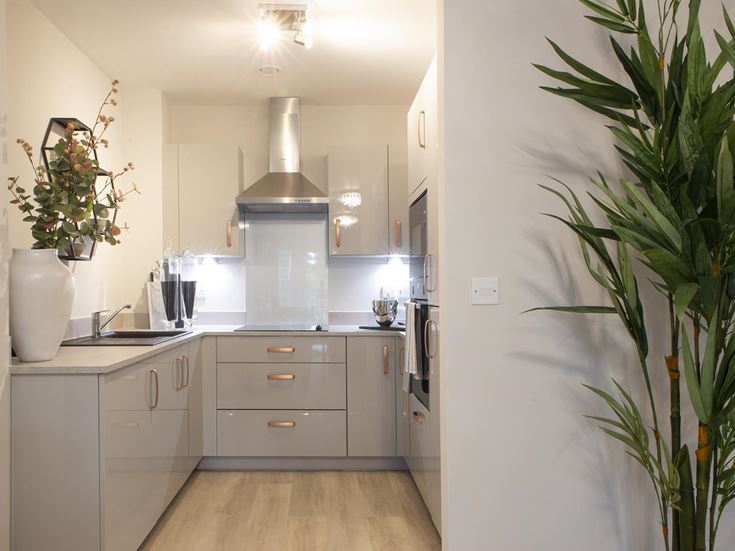 a kitchen with white cabinets
