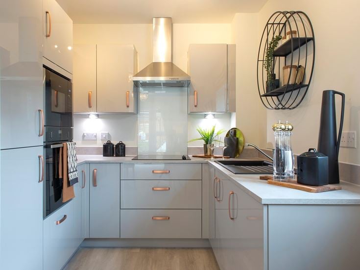 a kitchen with white cabinets