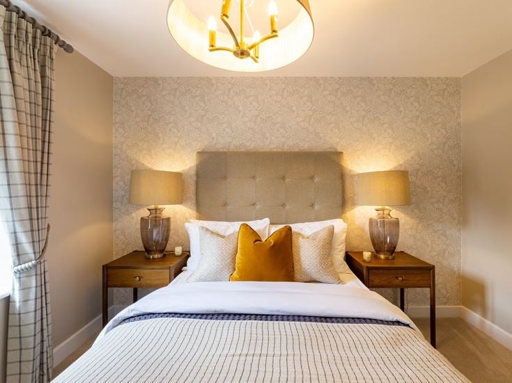 a bed with lamps on the side