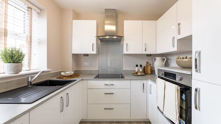 a kitchen with white cabinets