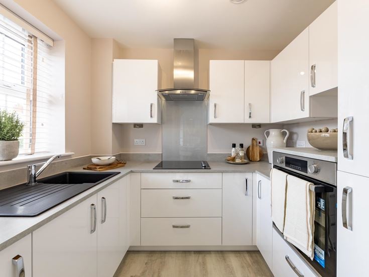 a kitchen with white cabinets