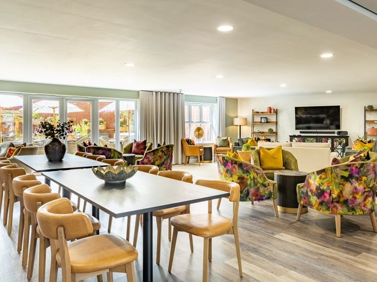 a large room with a table and chairs