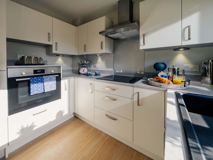 a kitchen with white cabinets