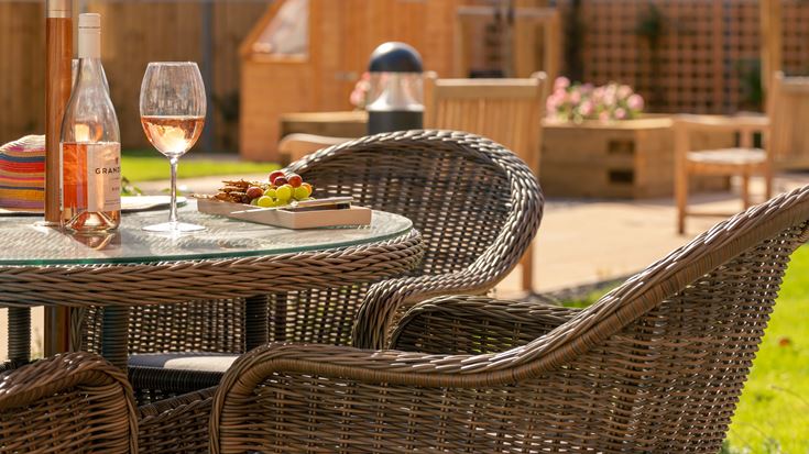 a table with a glass of wine and a bottle of wine on it