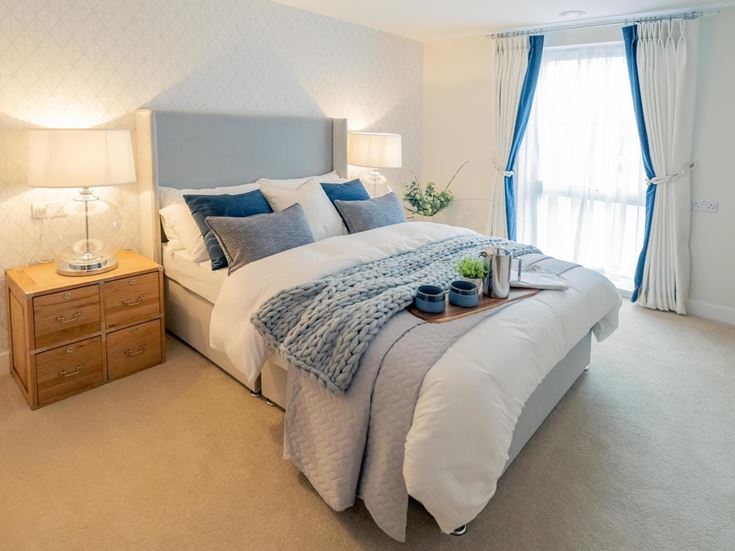 a bed with a white bed spread