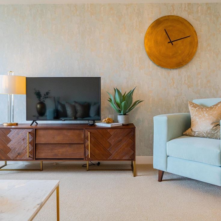 a living room with a tv and furniture