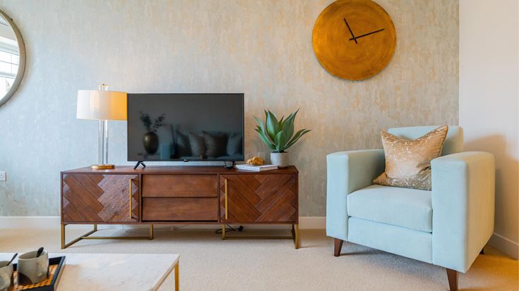 a living room with a tv and furniture