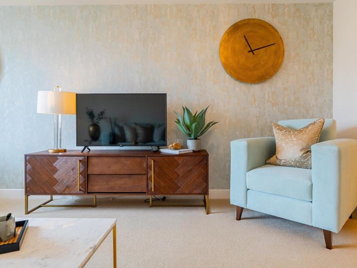 a living room with a tv and furniture
