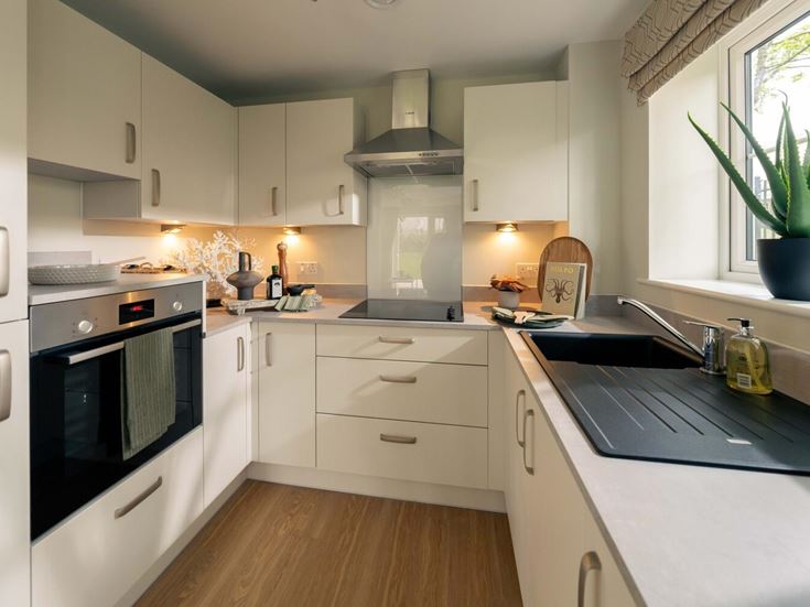 a kitchen with white cabinets