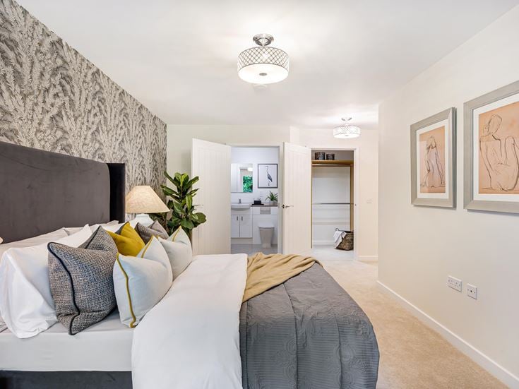 a bedroom with a bed and a couch