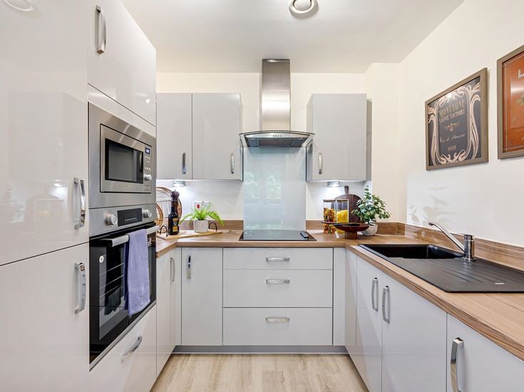a kitchen with white cabinets