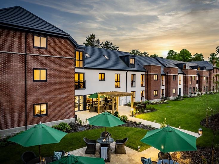 a backyard with a brick building