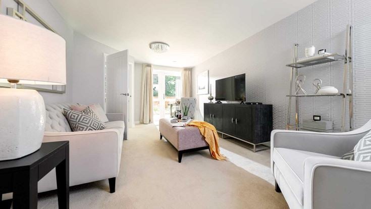 a living room with white furniture
