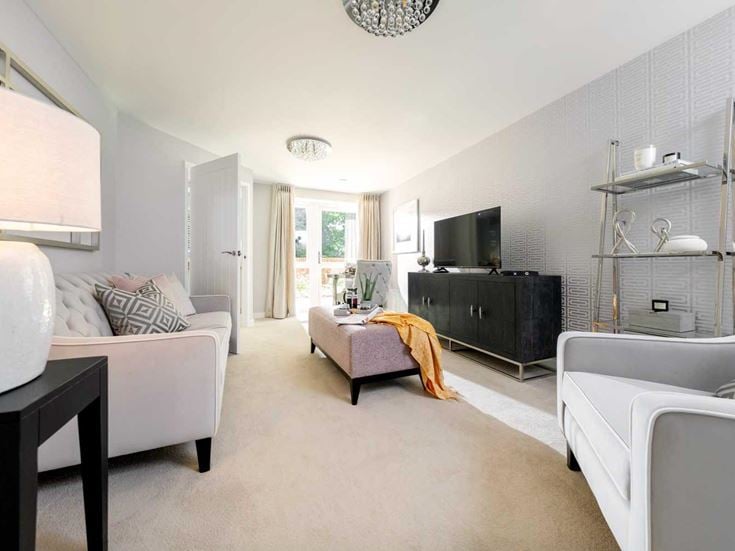 a living room with white furniture