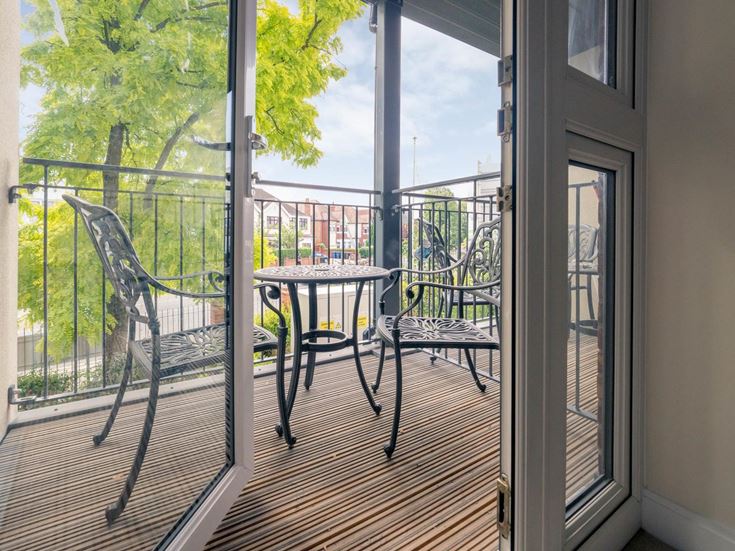a table and chairs on a deck