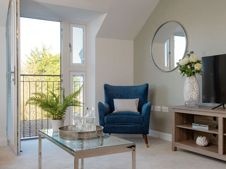 a living room with a blue chair