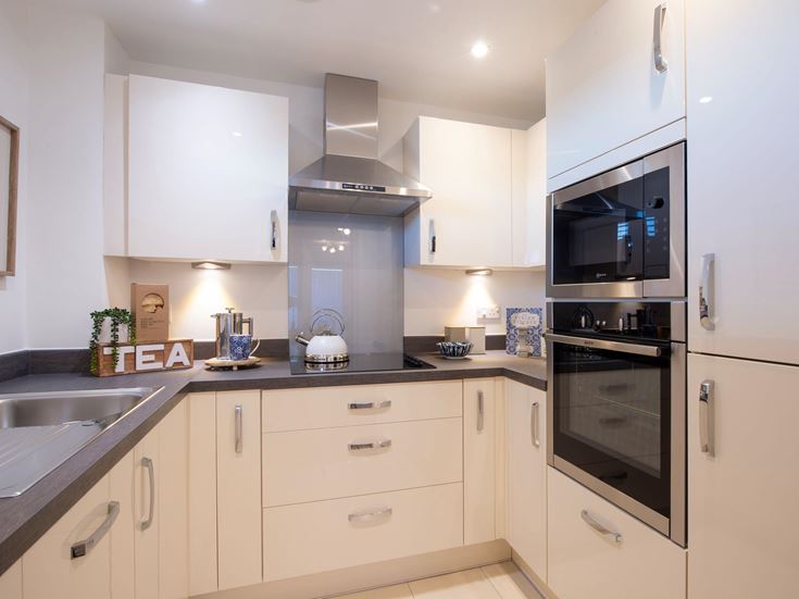a kitchen with white cabinets