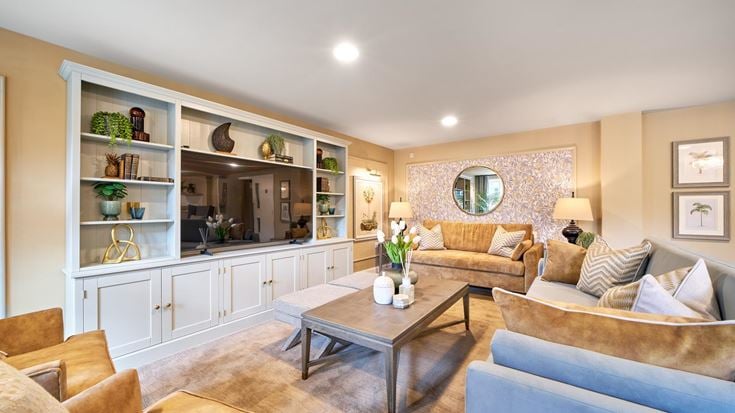 a living room with a large glass wall