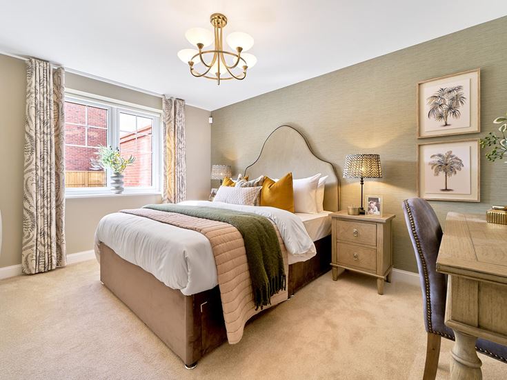 a bedroom with a bed and a chair