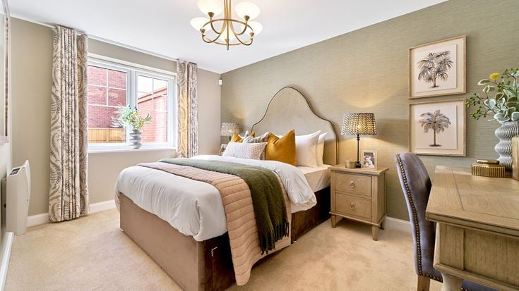 a bedroom with a bed and a chair