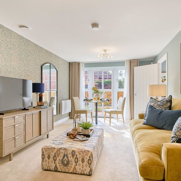 a living room with a tv and couches