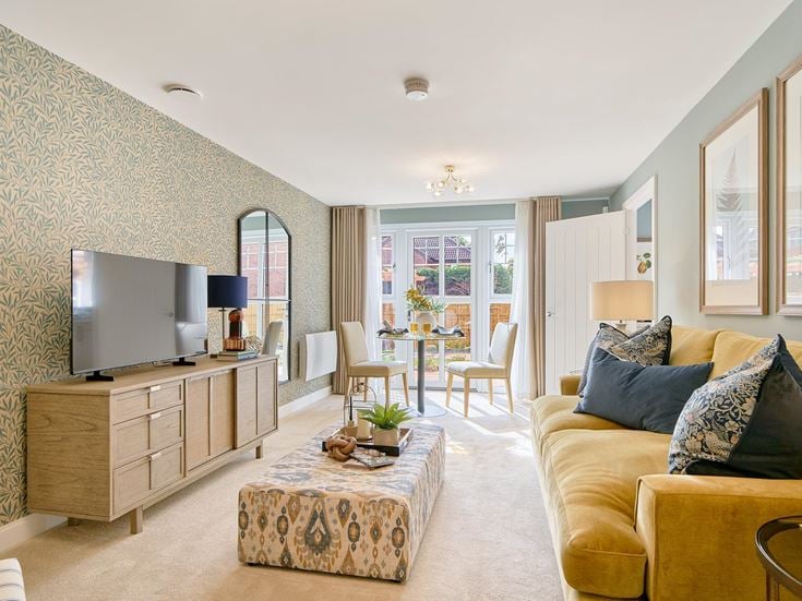a living room with a tv and couches