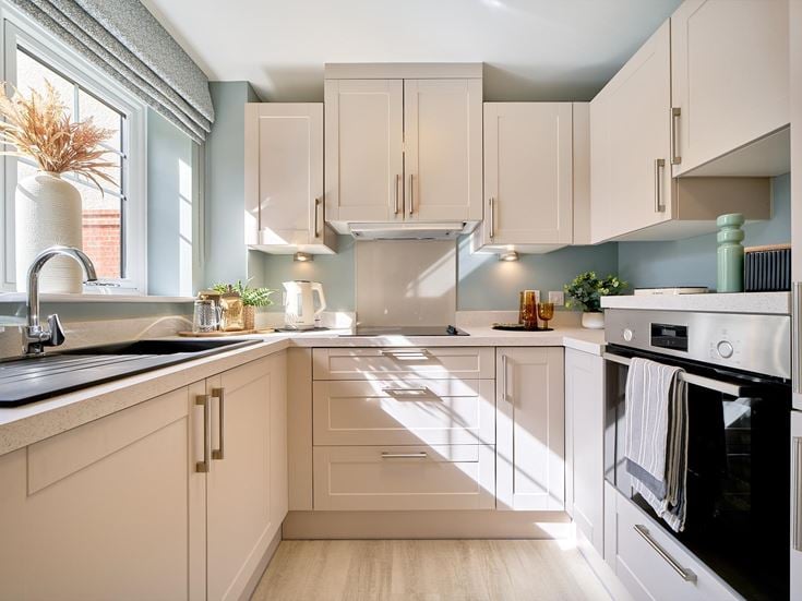 a kitchen with white cabinets